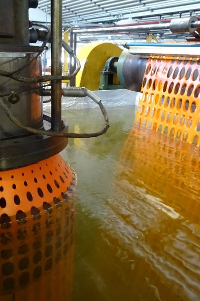 The machine is producing plastic netting.